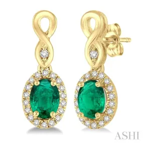 5x3 MM Oval Cut Emerald and 1/6 Ctw Round Cut Diamond Earrings in 10K Yellow Gold