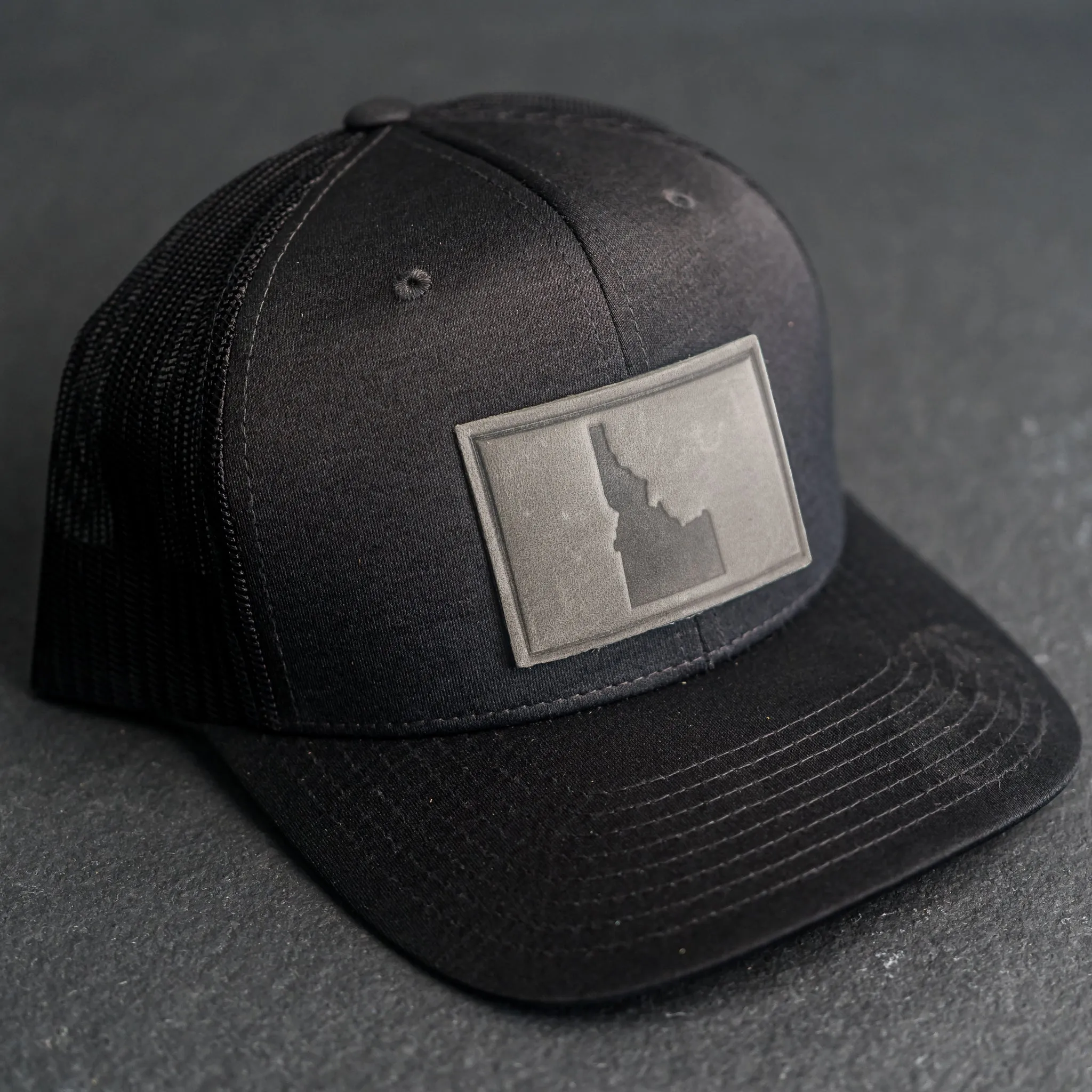 Leather Patch Performance Style Trucker Hat - Idaho Stamp