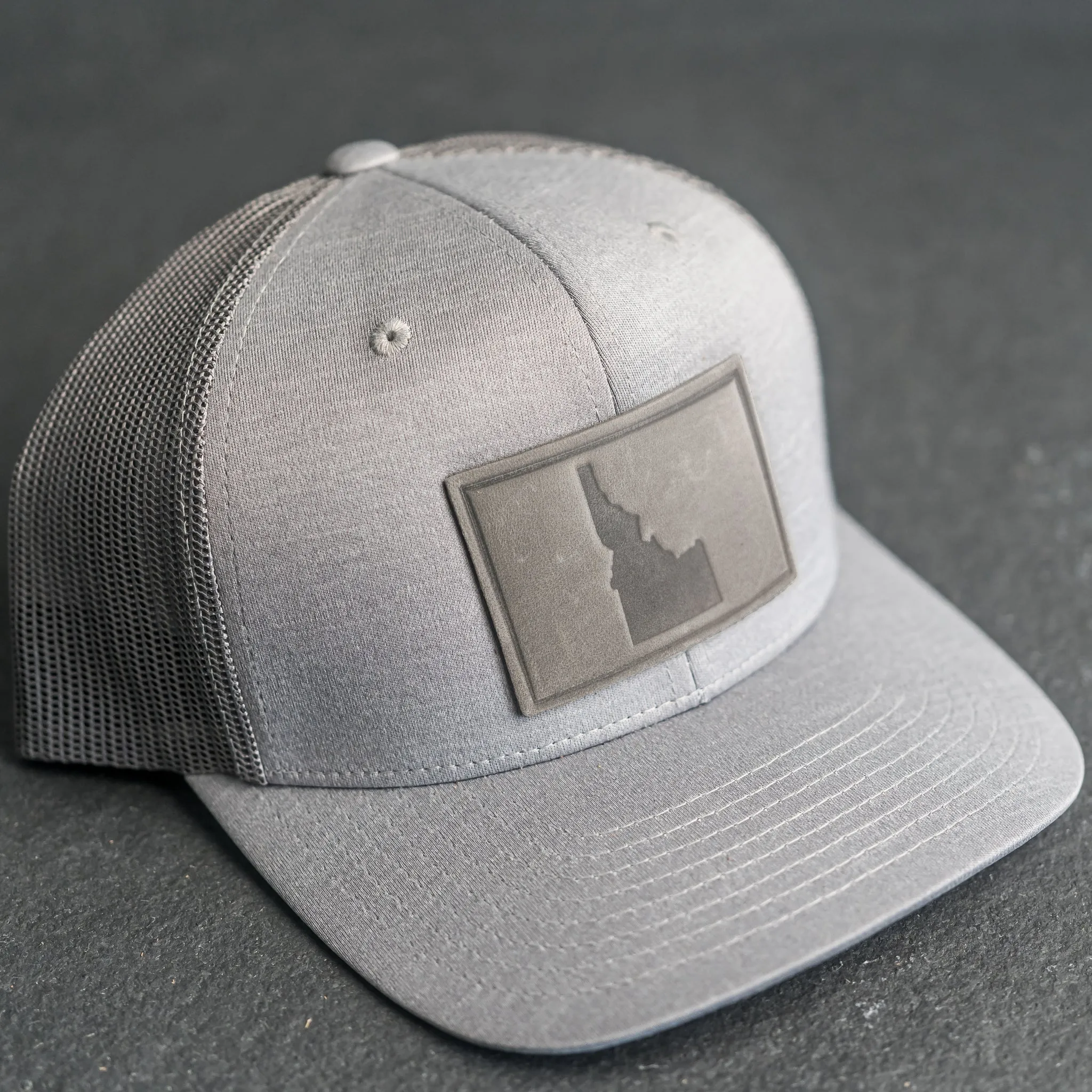 Leather Patch Performance Style Trucker Hat - Idaho Stamp